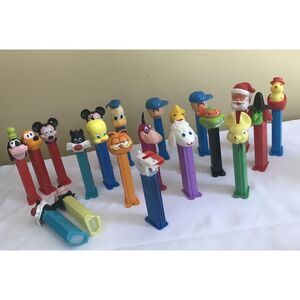 PEZ Dispensers Lot of 21 PEANUTS, DISNEY GARFIELD, SANTAS, LAMB AND MORE‎